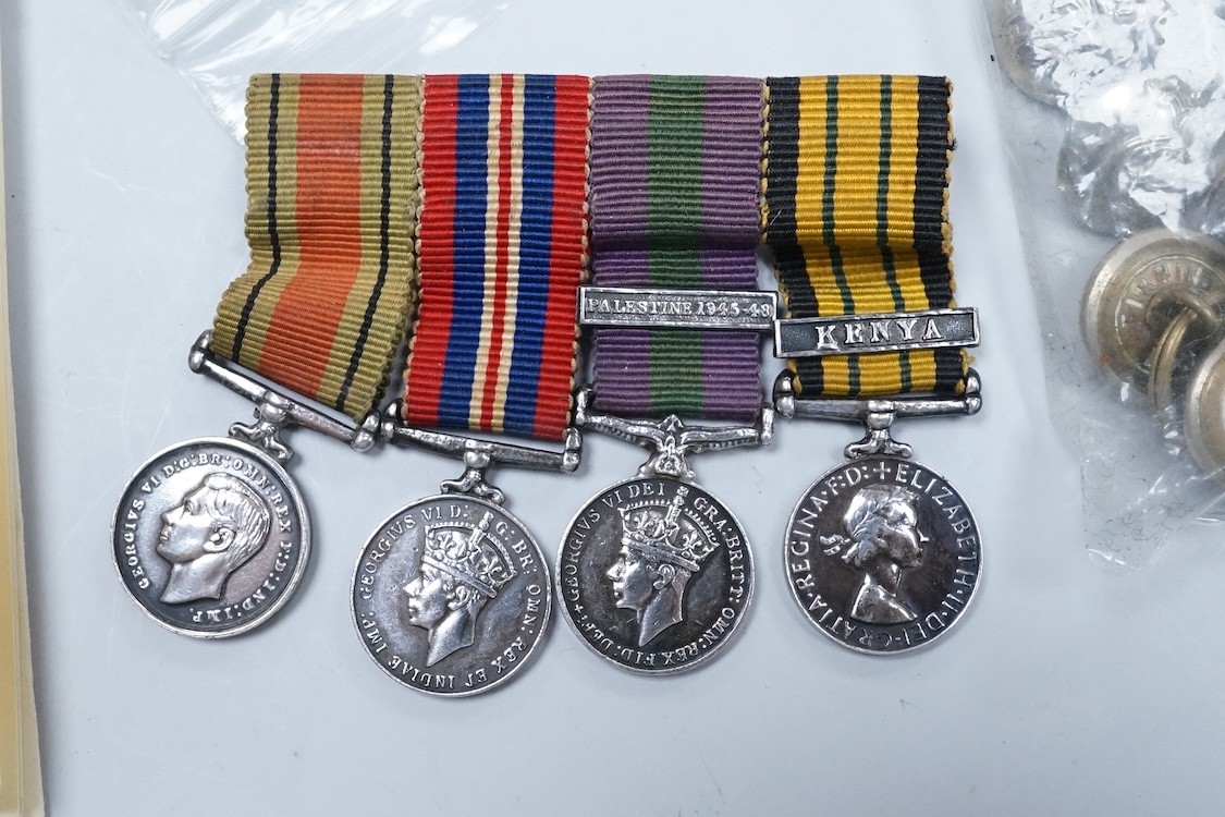 A cased ERII Colonial Police Force Medal for Meritorious Service awarded to John F. Brown, Asst. Supt. Kenya Police., together with a WWII miniature medal set including a General Service Medal with a clasp for Palestine